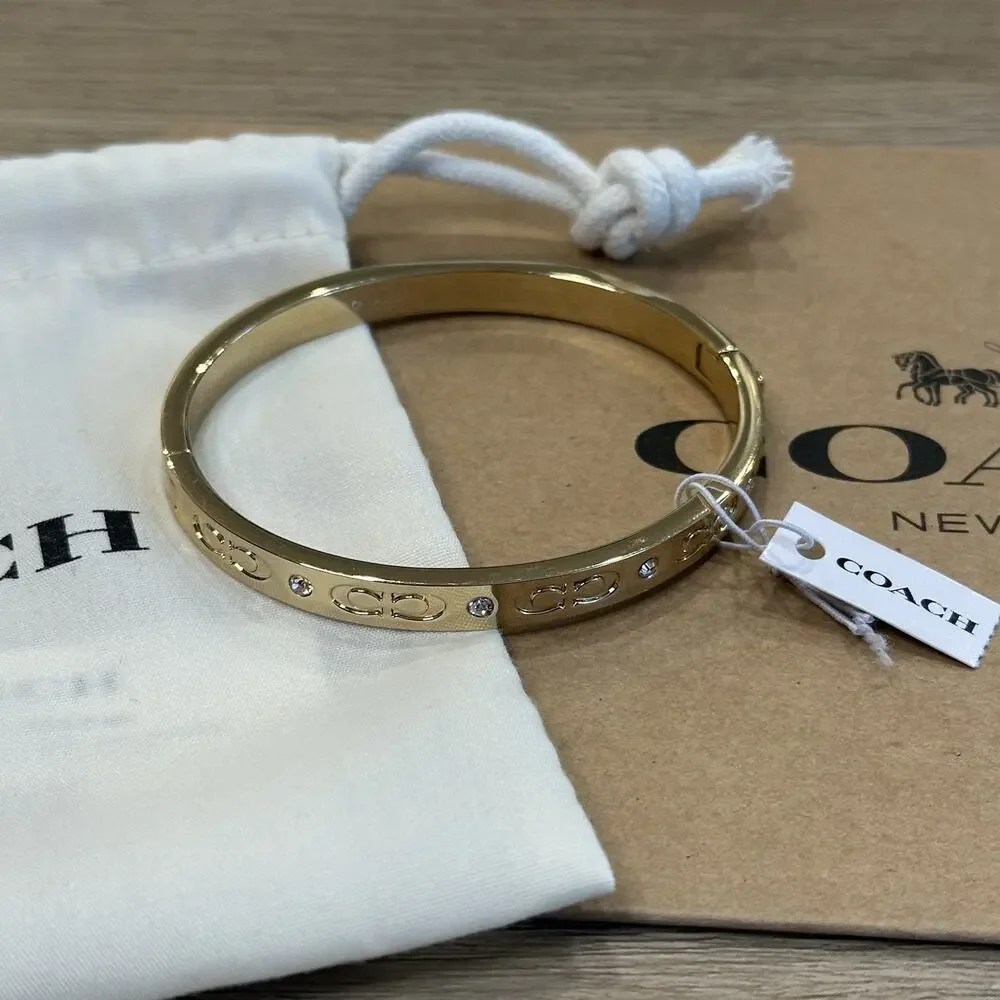 Coach “Kissing C” Signature Hinged Bangle Bracelet Jewelry Gold Rhinestone NWT